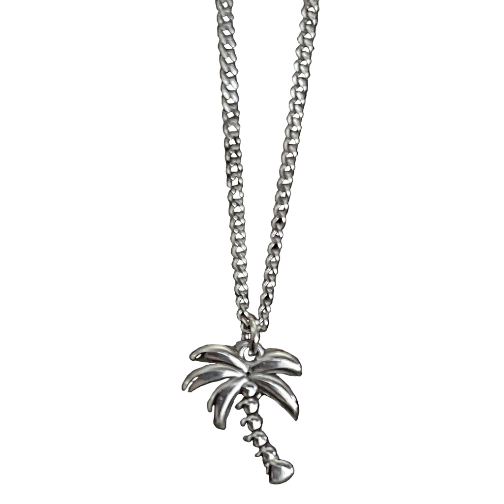 Silver necklace with a palm tree pendant on a white background