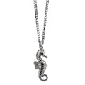 Silver seahorse pendant on a chain against a white background