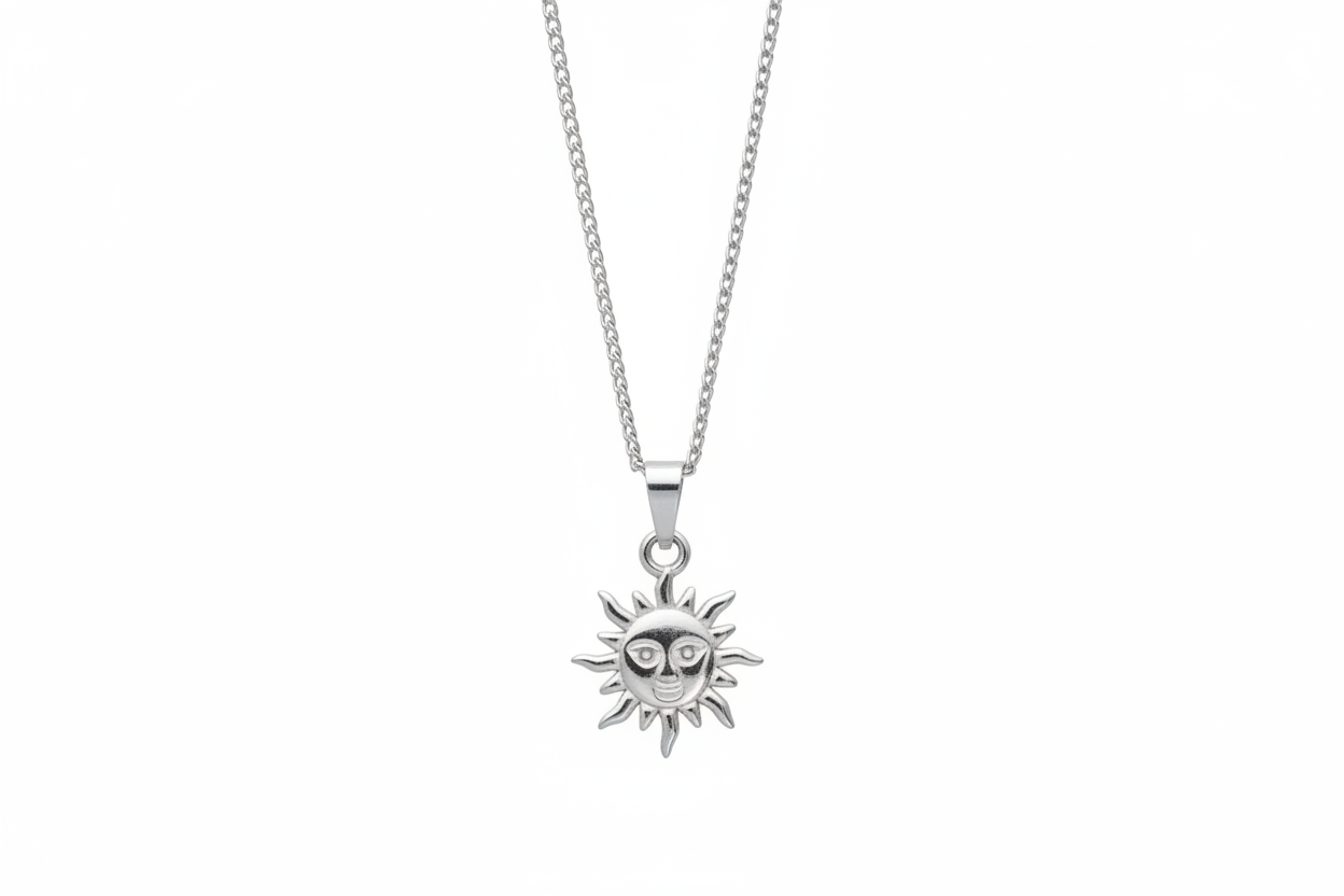 Silver sun-shaped pendant on a chain against a white background