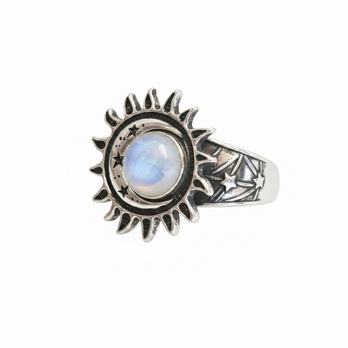 A silver-toned celestial ring featuring a central moon and sun design with a milky white moonstone, set against a plain white background.