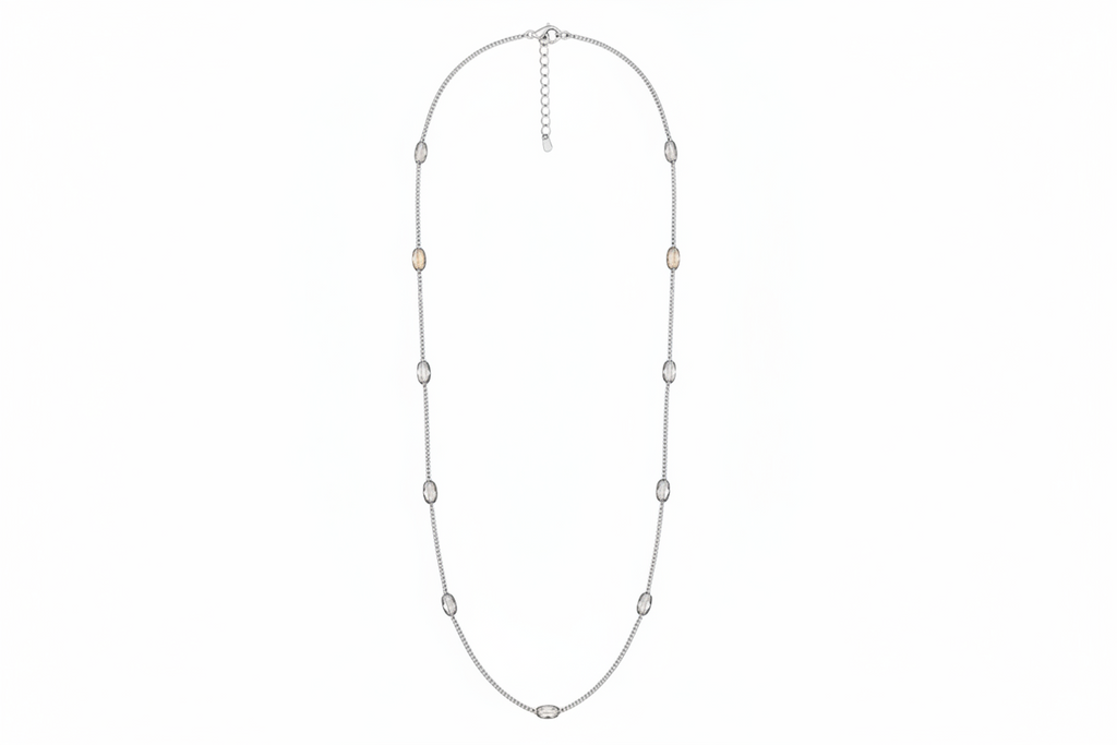 Silver necklace with small beads on a white background