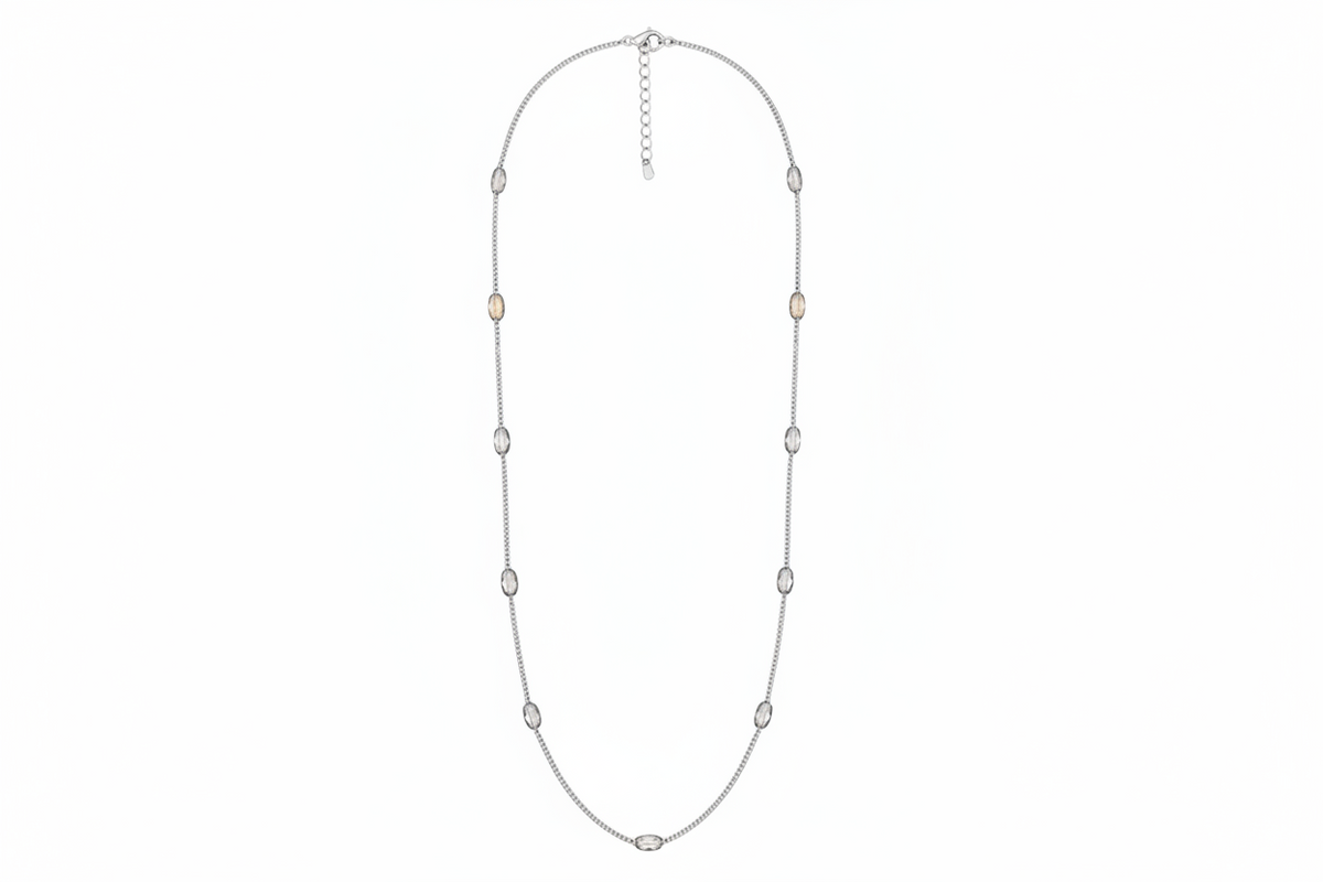 Silver necklace with small beads on a white background