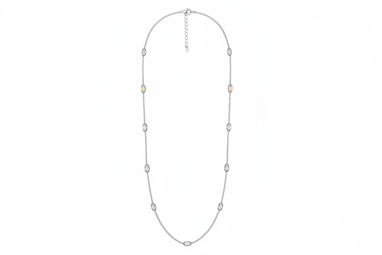 Silver necklace with small beads on a white background