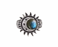A silver-toned ring featuring a crescent moon and sun design with a central oval labradorite stone showing blue and green iridescence, set against a plain white background.