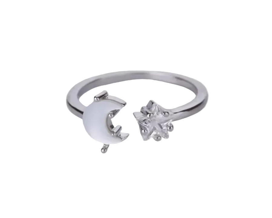Silver ring with a crescent moon and a zircon star against a white background. 